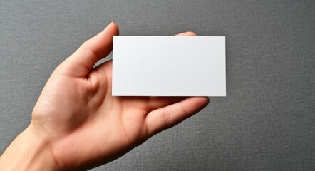 Delicately, a hand presents a blank business card, ready to be filled with your message and showcase your brand and content