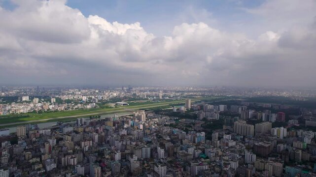 An expansive aerial panorama capturing the full breadth of Dhaka&rsquo;s skyline, rooftops, and urban form.