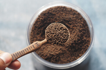 loose tea into a spoon for brewing fresh tea