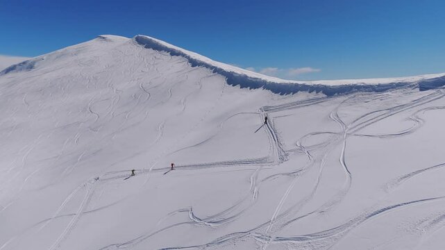 Ski Mountaineering On Snow-covered Mountain Terrain Over Caucasian Mountains In Svaneti Region, Georgia. Aerial Drone Shot