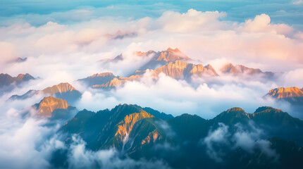 Stunning mountain peaks emerging through clouds at sunrise.