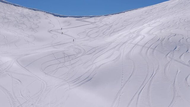 Ski Mountaineers Uphill Climbing Across Caucasian Mountains In Svaneti Region, Georgia During Winter. Aerial Drone Shot