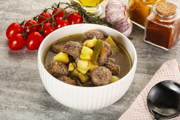 Soup with meatball and potato