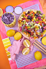 Color palette mood board in bright orange tones and purple decor for interior design and decor, top view