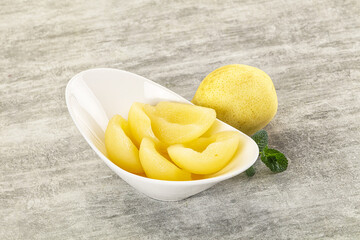 Canned yellow pear with syrup