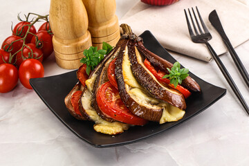 Baked tomato with mozzarella and tomato