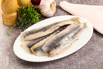Marinated salted herring fillet apetizer