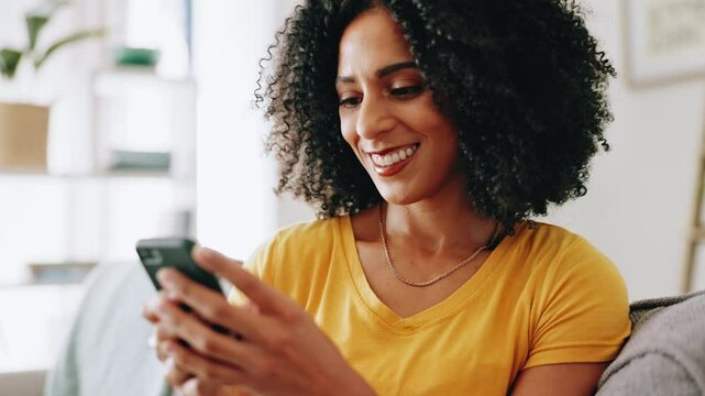 Woman, happy and typing with phone on sofa for dating site chat, social media post and text message response. Home, african person and smartphone for internet search, email notification and streaming
