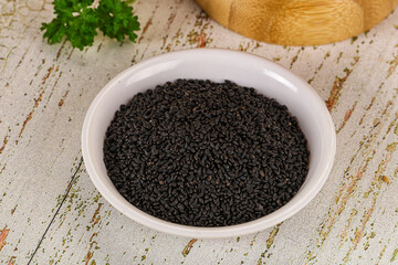 Black dry Nigella seeds in the bowl