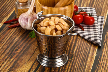 Baked white canned beans in the bowl