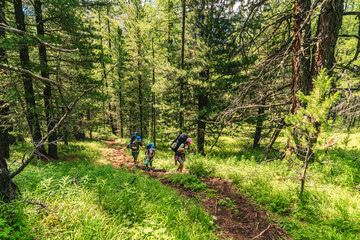 Obraz premium Mother and sons hikers adventuring trip in the back country. The silence around me awakens senses. Some of best life memories are hikes.