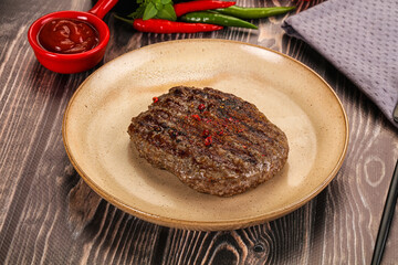Grilled beef burger cutlet with sauce