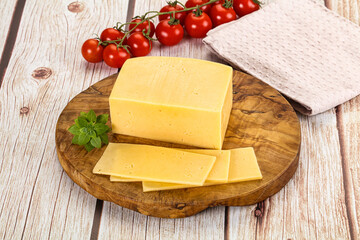 Yellow cheese piece with slices