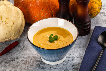 Vegan pumpkin cream soup served sesam