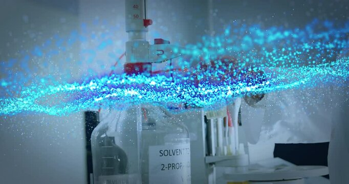 Scientist handling pipettes at bench by solvent bottle, showing lab technology with digital overlay