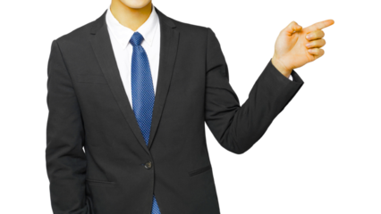 A professional businessman in a suit and tie stands in his office, hand pointing as a symbol of success for other businesspeople.