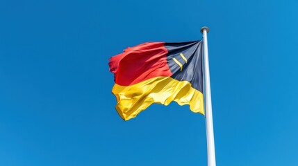 National flag of Belgium flying high, capturing movement and vivid colors outdoors