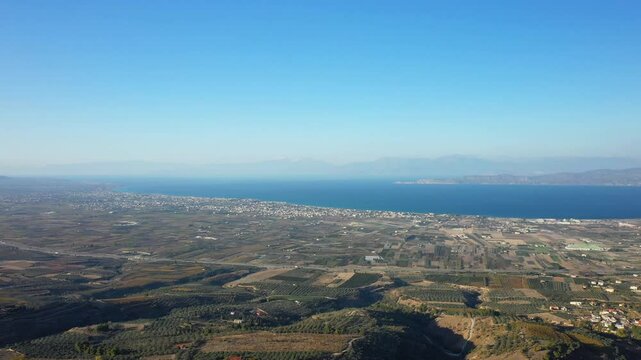 The Corinthian countryside and its fertile lands in Europe, Greece, Peloponnese, Corinthia, in summer, on a sunny day.&nbsp;