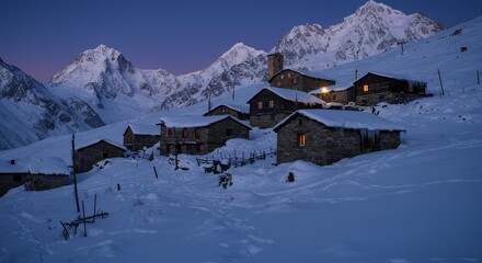 Fototapeta premium Village in Winter Snow with Mountains at Dusk