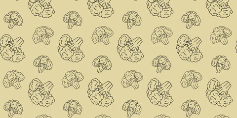 Pattern of hand-drawn broccoli on a soft yellow background showcasing a playful vegetable design