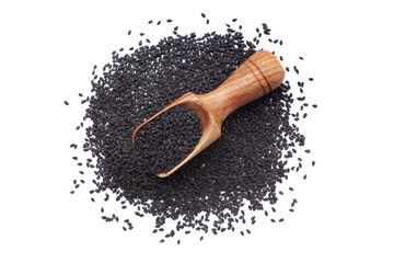 A wooden scoop filled with organic Black Sesame (Sesamum indicum) Seeds, placed on a heap of black sesame seeds, isolated on a white background.