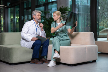 Two colleagues discussing xray results and looking involved