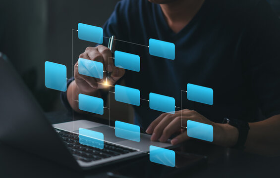 Workflow diagram overlay on laptop screen. Business process mapping and data structure visualization. Man working with digital flowchart interface. Smart planning, project task management