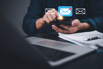 Man checking email alert pops up on smartphone with notification icon. Digital communication, mobile messaging and smart connectivity.Online contact, remote work