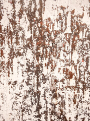 Aged concrete surface with peeling paint and weathered texture