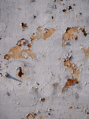 Rusty peeling paint texture on aged concrete wall surface