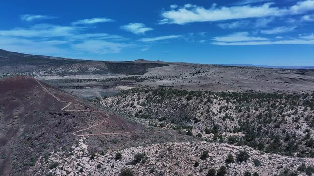 Aerial volcano cinder cone mountain landscape St George Utah. Southwestern desert mountains landscape. Geological wind, weather and water carved erosion. Hiking trails and nature travel. Environment.