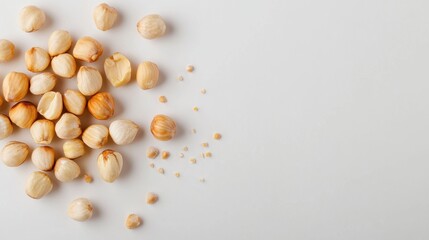 Crisp overhead view of hazelnut grouping, raw kernels with shells, clean studio look