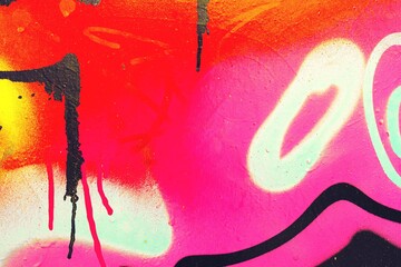 Graffiti art in neon pink, orange, yellow with black drips. Urban 90s style, vibrant colors,...