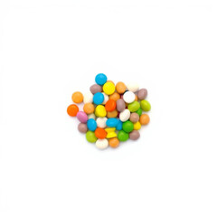 small pile of assorted colorful candy pieces is arranged on white background, showcasing variety of vibrant colors and round shapes. image evokes sense of fun and sweetness