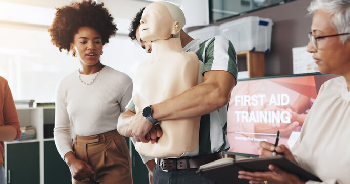 First aid, training and people with choking dummy for CPR, abdominal thrusts and life saving procedure in office. Simulation, presentation and demonstration for employee rescue and workplace safety
