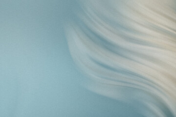 Abstract light blue and beige background with blurred textures creating a soft and dreamy atmosphere