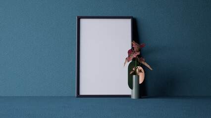 A minimalist interior scene featuring a blank frame and a stylish vase with a plant, blue wall. 3d rendering.