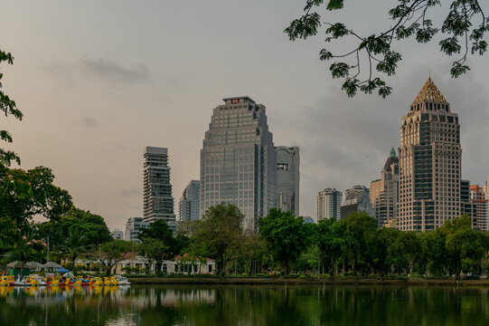 Bangkok, Thailand - March 17 2025 : View of HSBC Head Offce and GPF Witthayu Towers from Lumphini Park in the morning, Bangkok.