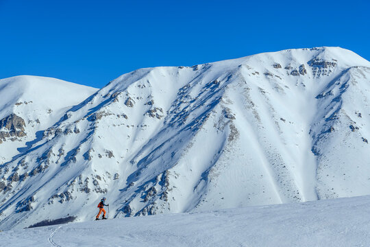 Woman backcountry skiing in the Appennines, Italy