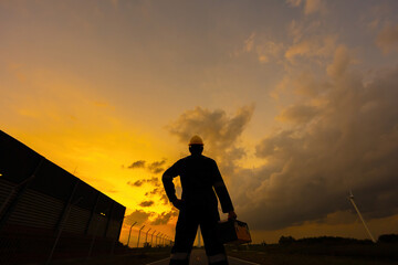 This Asian engineer silhouette at the heart of the wind energy industry demonstrates how innovation...