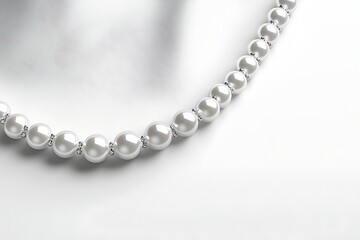 Obraz premium Elegant pearl necklace adorns white backdrop, perfect for jewelry display or luxury product showcase