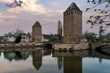 Strasbourg reflected in the River Ill at dusk in Alsace, France

