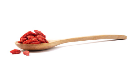 Dried goji berries in spoon isolated on white background