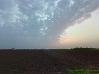 plowed field at sunset
