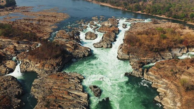 Khone Falls on the Mekong River among the rocks and arid countryside in Asia, Laos, Champasak, 4000 Islands, Don Det, on a sunny day.&nbsp;