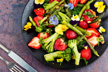 A refreshing asparagus salad with strawberries.