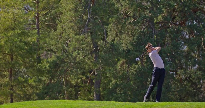 Young golfer playing on a sunny spring day in Switzerland, showcasing precise chipping, putting, bunker, and approach shots. Perfect for sports, lifestyle, and outdoor themes.