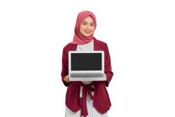 Smiling young Asian Muslim woman in hijab holding a laptop with blank screen for product display isolated on transparent background