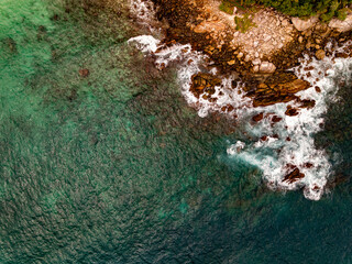 Top view seashore waves nature background,Amazing waves crashing on rocks seascape view