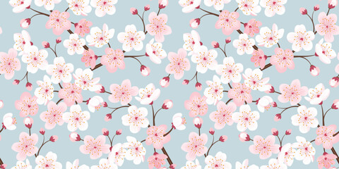 Seamless pattern of sakura flowers and branches on a blue background. Vector illustration.